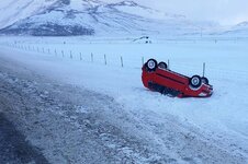 Car-accident-in-Iceland-in-winter-red-car-upside-down-next-to-an-icy-road.jpg.optimal.jpg